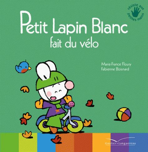 PETIT LAPIN BLANC FAIT DU VELO